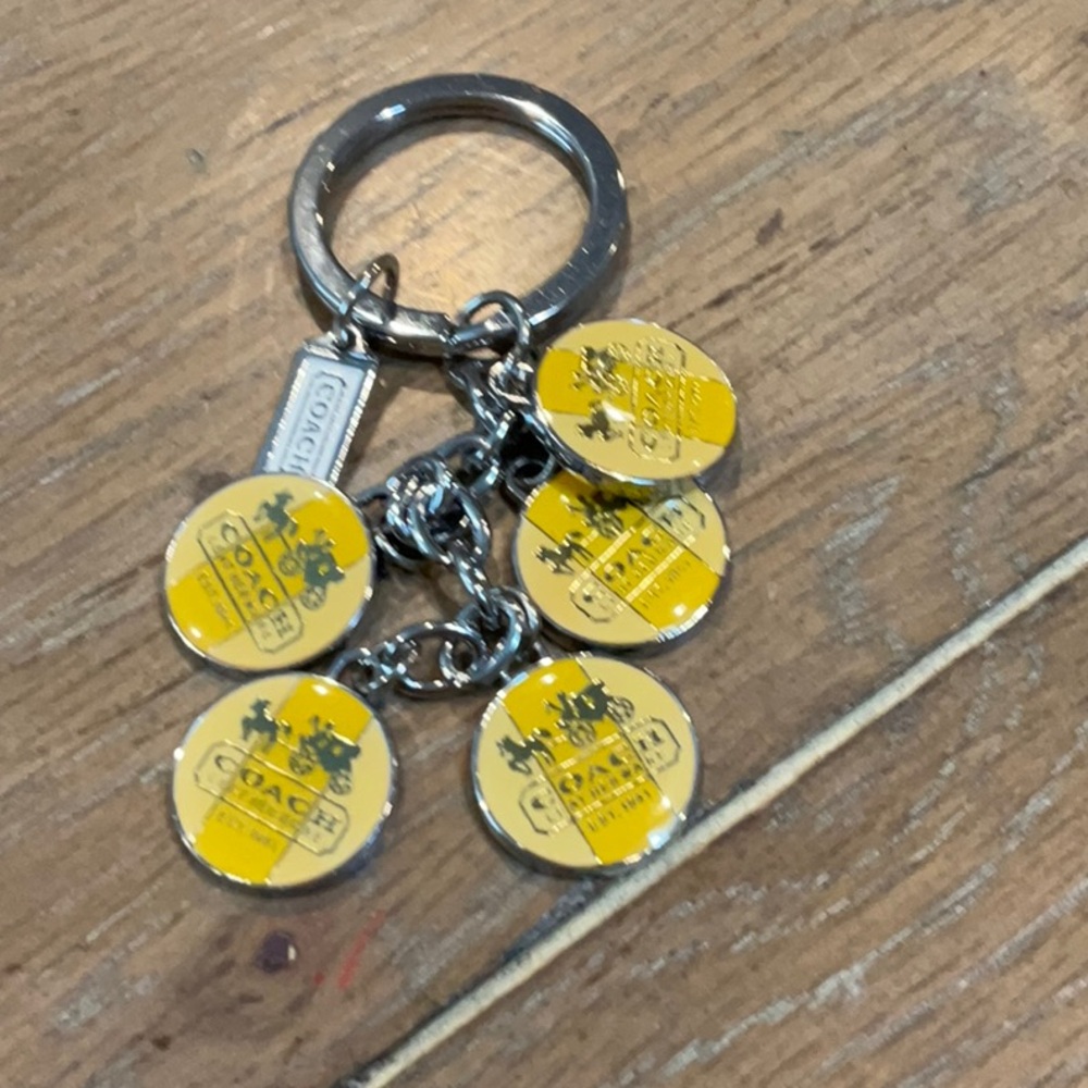 Coach keychain - 5 yellow medallions & tag